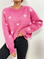 Detail van roze geribbelde gebreide trui met wit hartjes jacquardpatroon voor dames - S / Roze