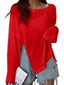 Detail of red loose-fit knit sweater featuring high side slits and long drop shoulder sleeves - Red