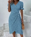 Detailed view of a blue floral wrap dress with a V-neck and short puff sleeves - Blue