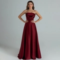 Detail of elegant wine red satin strapless evening gown with draped pleated neckline - S / Burgundy