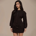 Close-up of knit two-piece set featuring cardigan buttons and a large bow on the skirt - S / Black