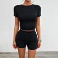 Detail view of black slim-fit cropped t-shirt and high-waist biker shorts two-piece set - S / Black