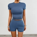 Close-up of slim fit grey blue two-piece set featuring short sleeve top and high waist shorts - S / Grey Blue