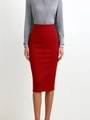 Close-up of red high-waisted pencil skirt with slim fit design and stretch fabric - Red
