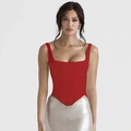 Detail of red corset crop top featuring square neckline and asymmetrical V-hem design - XS / Red