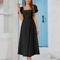 Elegant black mid-length A-line dress with square neck and puff sleeves in Mediterranean setting - XS / Black