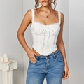 Sultry white lace corset top featuring a tie-up front and a stylish pointed hemline - XS / White
