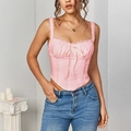 Pink lace bustier top with spaghetti straps and handkerchief hem on a fashion model - XS / Pink