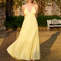 Elegante vestido largo amarillo con cuello halter, escote en V profundo y falda escalonada - XS / Amarillo