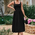 Elegant black square neck sleeveless midi dress with pleated detail and bow in garden setting - XS / Black