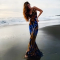 Bohemian backless halter maxi dress with blue and yellow tiger print on a beach - Tiger Print