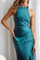 Detailed close-up of teal satin halter neck dress with elegant side slit and silk texture - Malachite green