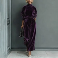 Detail of dark purple velvet tracksuit featuring high-neck zipper top and wide-leg pants - Purple