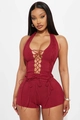 Close-up of wine red halter romper featuring criss-cross lace-up details and ribbed knit - S / Burgundy