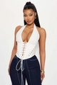 Detailed view of white halter corset top featuring cross lacing and silver metal rings - White