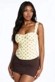 Detail of yellow polka dot corset top with lace trim and structural boning seams - S / Yellow