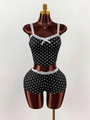 Women's black polka dot two-piece pajama set with lace trim and bow accent on mannequin - S / Black Polka Dot