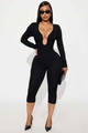 Schmal geschnittener schwarzer Langarm-Jumpsuit mit tiefem V-Ausschnitt und hoher Taille - S / Schwarz