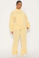 Women's cream yellow tracksuit featuring a zip-up stand collar top and wide-leg sweatpants - S / Yellow