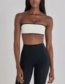Detail view of the high-elastic white bandeau top with black contrast piping for fitness - S / Tops / Milky White (Black Piping)