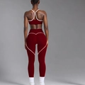 Detail of red yoga set showing heart-shaped stitching on leggings for butt lifting effect - M / Long Style Top And Bottom / Burgundy