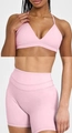 Detail of pink V-neck sports bra and high-waisted seamless shorts for yoga workout - Peach Pink Set