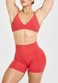 Detail of red two-piece sports set with V-neck bra and high waist compression shorts - Red Zirconia Set