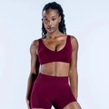 Detail view of burgundy seamless U-neck sports bra and high-waisted shorts set - XS / Berry