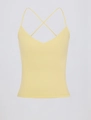 Dettaglio del gilet yoga giallo chiaro con scollo a V profondo e spalline incrociate - S / Giallo