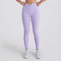 Close-up of purple yoga leggings featuring a high waist cross knot and white side stripes - Light Purple Trousers