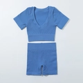 Flat lay of royal blue ribbed seamless yoga set showing texture and V-neck design - S / Blue