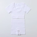 Detailed view of white ribbed two-piece yoga set with V-neck crop top and high-waist shorts - S / White