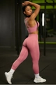 Detail showing the seamless cross-back sports bra and high-waist pink yoga leggings - Pink