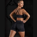 Set yoga nero senza cuciture con reggiseno sportivo incrociato e pantaloncini scrunch fitness - S / Nero