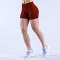 Detail of high-stretch seamless yoga shorts in dark red with scrunch butt lift design - XS / Bottoms / Burgundy