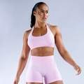 Detail view of light pink seamless yoga set showing racerback sports bra and ribbed shorts - XS / Barbie Pink