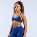 Detail of high-stretch matte yoga set showing halter neck sports bra and legging texture - Deep Sea Blue