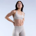 Close-up of seamless yoga set with ribbed texture and halter neck backless design - XS / Feather Rice