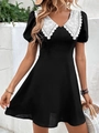 Vestido negro de línea A con mangas cortas, cuello de encaje blanco y bordado floral - XS / Negro