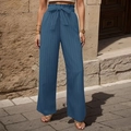 Dettaglio dei pantaloni blu a gamba larga a vita alta con fiocco e tessuto a pieghe - Taglia S / Blu nebbia