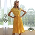 Vibrant yellow polka dot pleated midi dress with short sleeves and a belted waistline - Yellow