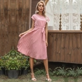 Pink polka dot summer dress with pleated hem and waist tie for a casual vacation look - Pink
