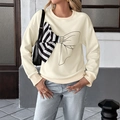 Felpa oversize da donna crema con fiocco 3D a righe e stampa grafica nera sul davanti - S / Beige