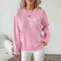 Jersey navideño rosa con estampado jacquard de lazos blancos y cuello redondo - S / Rosa