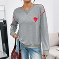 Grey long-sleeve sweatshirt featuring red heart embroidery and contrast shoulder piping - S / Gray