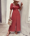 Detail of red floral romper featuring puff sleeves and elastic high-waisted smocked design - S / Red