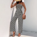 Ärmelloser schulterfreier Jumpsuit mit weitem Bein und schwarz-weißem Rautenmuster - S / Schwarz