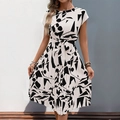 Elegant white pleated dress with black abstract geometric prints and a waist tie belt - S / White