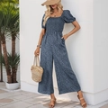 Detail of blue leopard print jumpsuit featuring square neck and puff sleeve design - Haze Blue