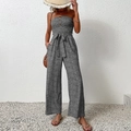 Strapless jumpsuit met wijde pijpen, zwart-witte bloemenprint en strikceintuur - S / Zwart